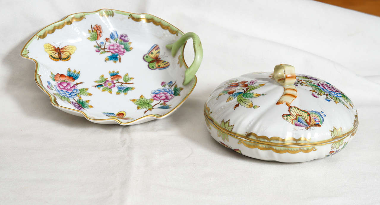Two Herrend candy dishes, one leaf form and the other a
 mini-tureen covered dish. Butterfly and flower decoration on both against white ground. Covered dish measures 6.5