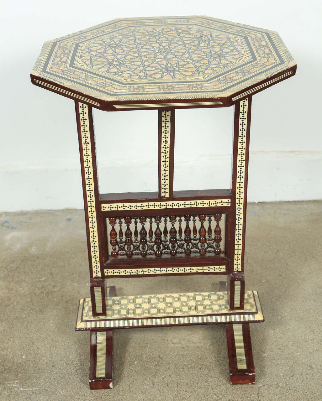 Egyptian octagonal side table, marquetry inlaid with detail fret work in the bottom.
Tilt top table.