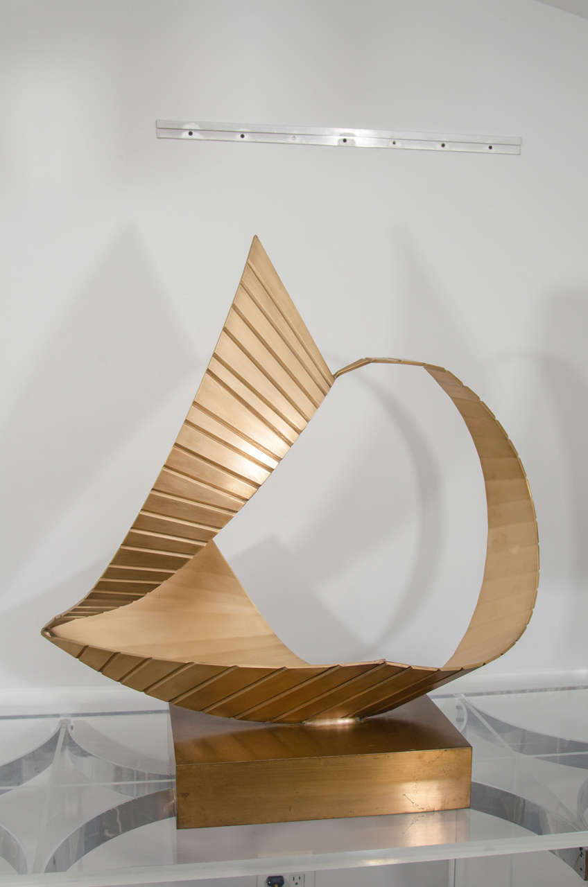 Nautical inspired brass sculpture reminiscent of billowing sails . Finely made with ridge detailing. Very interesting and transforms from a variety of angles.