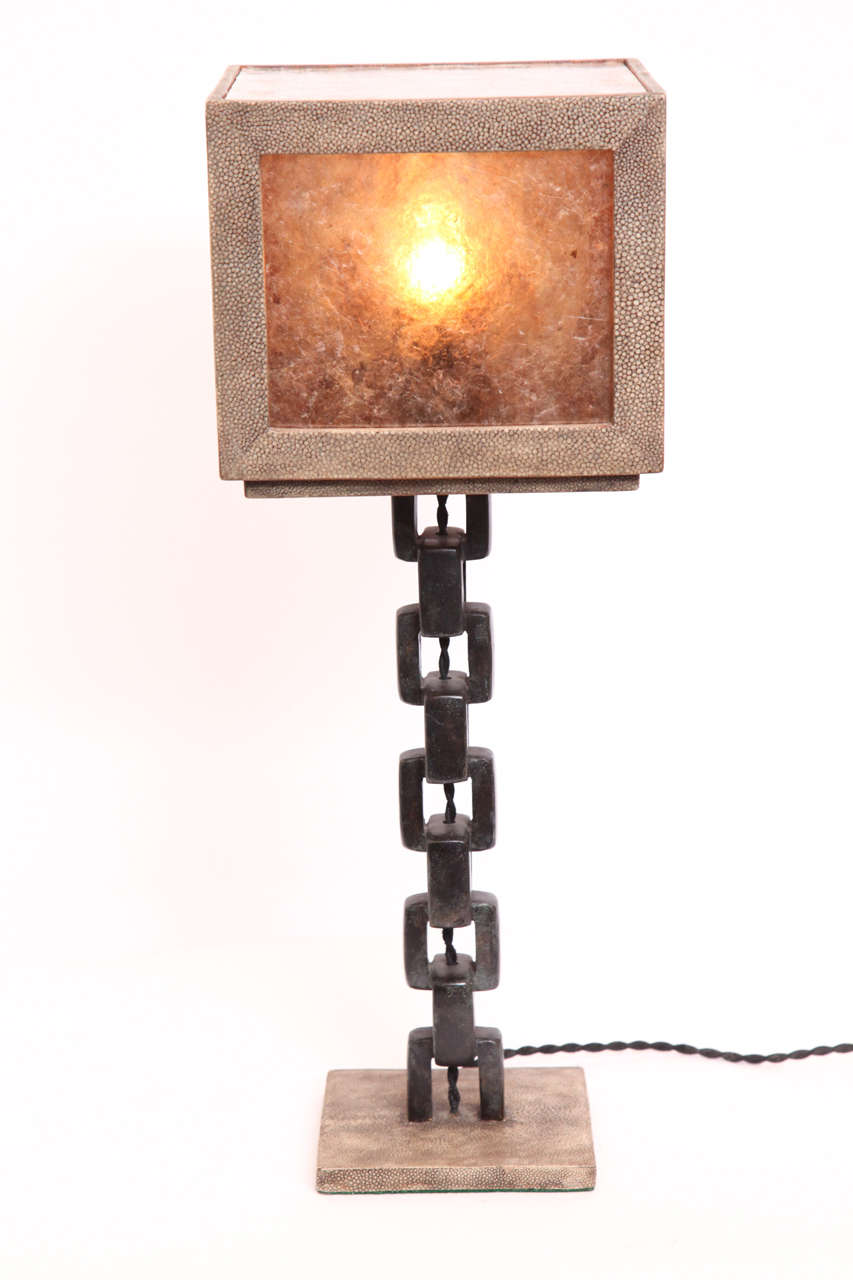A 1980s French modernist patinated iron and shagreen table lamp.