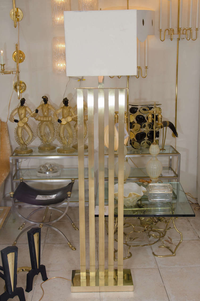 Rectilinear standing brass floor lamp.
