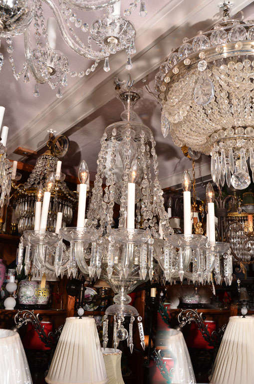 Czechoslovakian Crystal Chandelier,  12 lights with wheel cut bobesches each carrying seven cut triangle spearhead prisms.  Each arm has a double strand of alternating 1