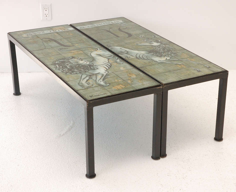 A pair of custom made iron frame cocktail tables featuring eglomise decorated tops by Bottega Karin. Birthdates and zodiac signs are incorporated into the glass tile  table top  designs.  Bottega Karin had a long standing history of working with