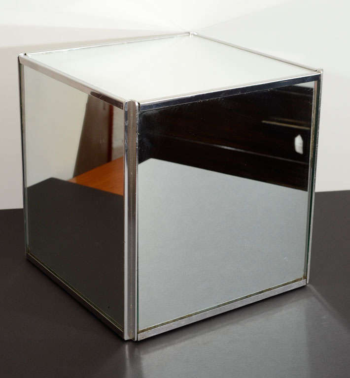 Charming and versatile pair of mirrored cubes. They have a small scale and can easily be placed around as side tables or stands.
