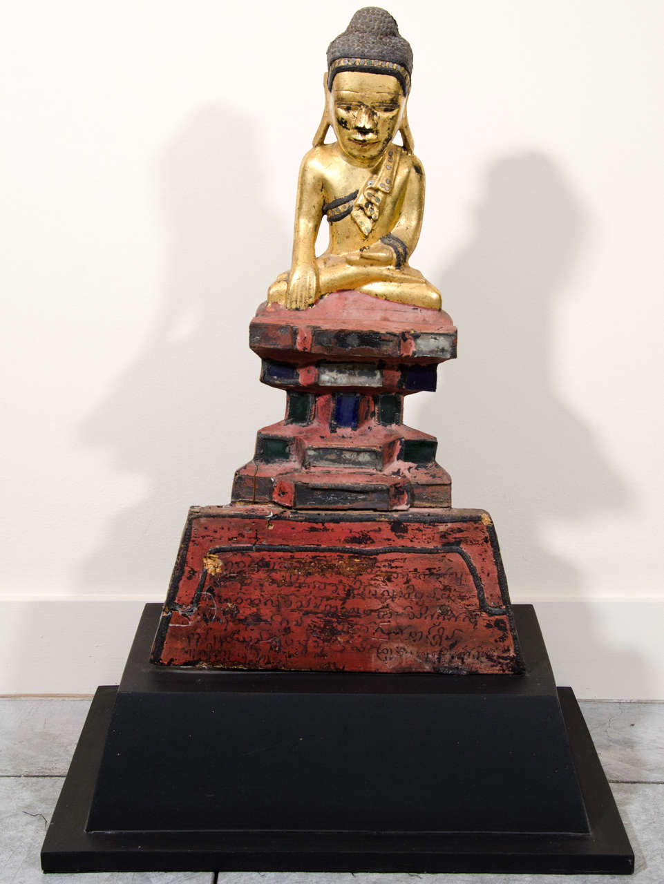 An unusual Karen Buddha atop red pedestal with Buddhist scripture in Burmese characters. From Burma c. 1900.
BH440a