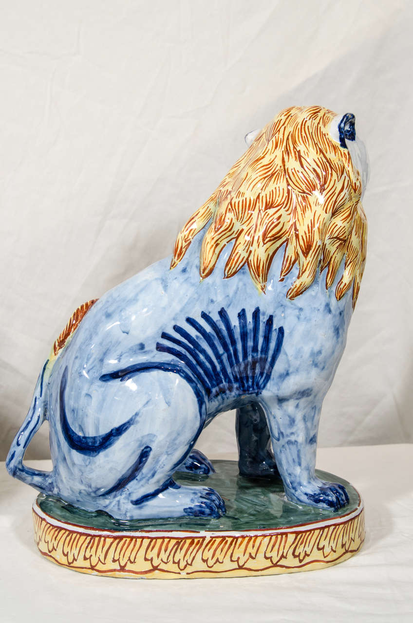 A Pair of Antique Faience Lions Painted in Polychrome Blue and Yellow 3