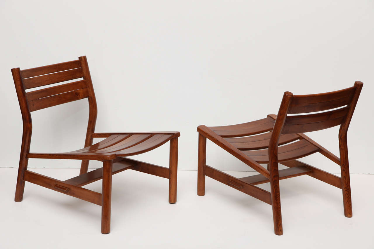 A pair of oak lounge chairs by Pierre Gautier-Delaye

A similar "Week-end" chauffeuse in Landes pine is shown on page 209 of  Les Décorateurs des années 50 by Patrick Favardin