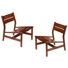 Pierre Gautier-Delaye, Pair of oak lounge chairs, France, c. 1950