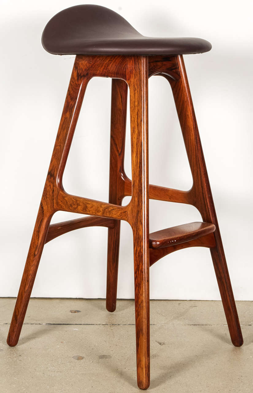 A set of three (3) bar stools by Erik Buck in the rare all rosewood model.  Made by the designer for Oddense Maskinsnedkeri A-S. Denmark, circa 1950. Signed.

Upholstered in brown leather upholstery.  Available in COM/COL at no additional charge. 