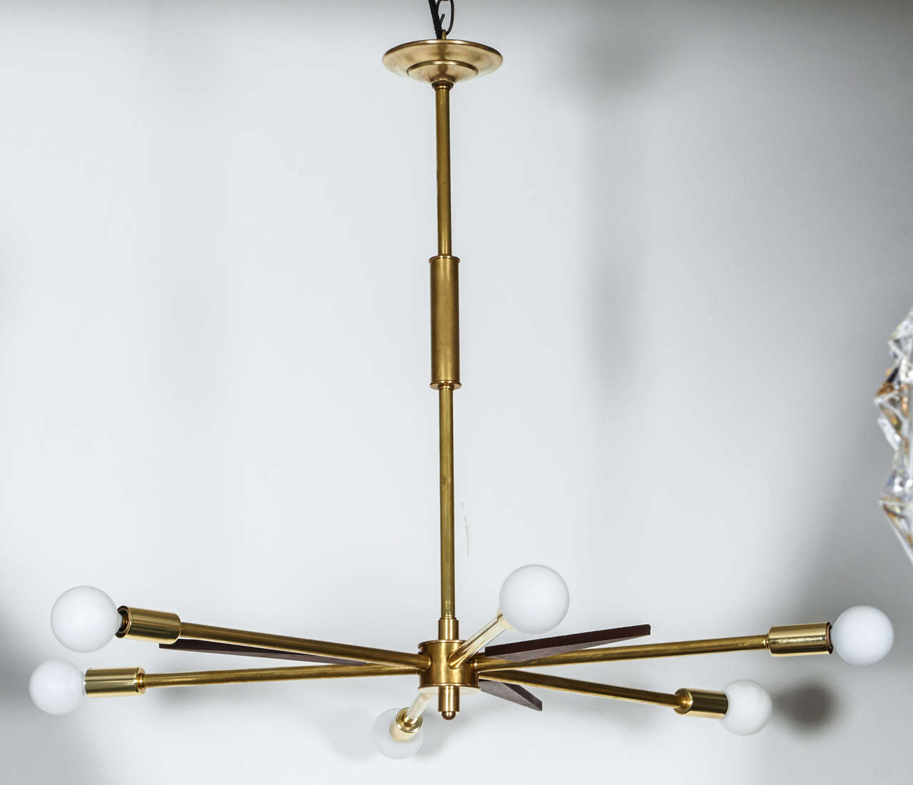 Sputnik-style brass light fixture with wood spear-shaped accents.  USA, circa 1970.  

Restored and rewired for U.S. use; takes six chandelier-base bulbs, 40 watts max per bulb.

Height/stem may be customized; the current height is 24