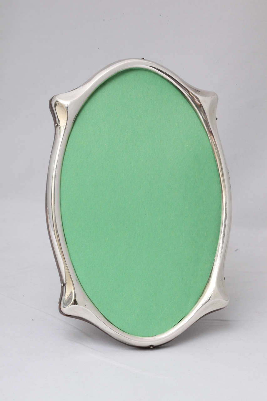 Unusual, Art Deco, sterling silver oval picture frame, Birmingham, England, 1922, Sanders & MacKenzie - makers. Wood back. @6 3/4