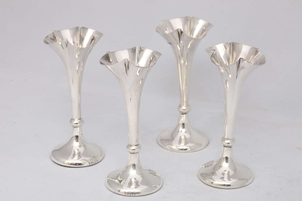 Suite of four, sterling silver, Edwardian bud vases, London, 1901, Horace Woodward & Co, Ltd. - makers. Opening of each vase is fluted with a beaded border. Each vase is @4
