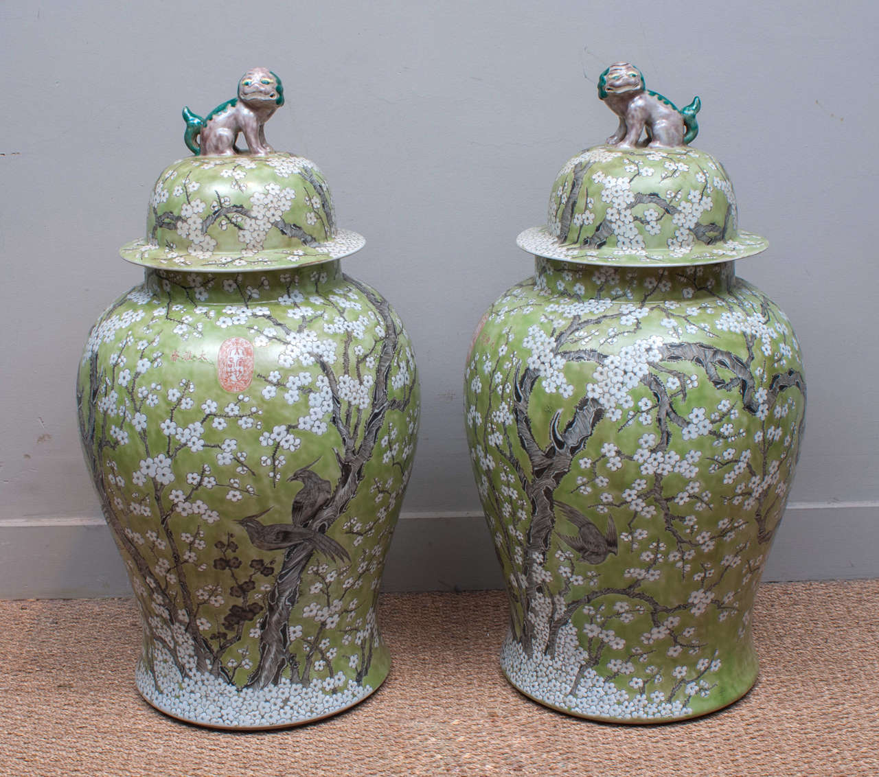 Exquisite pair of Chinese porcelain jars hand-painted by artisans from Jingdezhen, home to the Imperial kilns of the Emperors of ancient China.