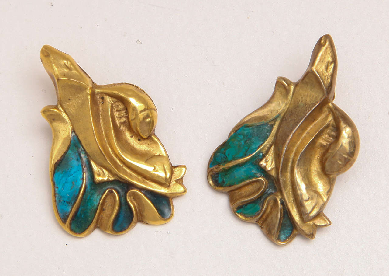 Pair of clip-on earrings in bronze with turquoise enamel decoration.
