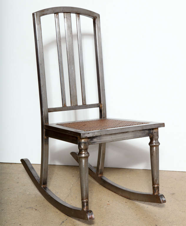 Compact Circa 1910, rare form in Iron, Rocking Chair with caned seat.  Perfect as nursing Rocker