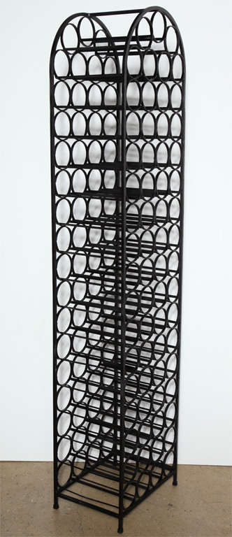 Tall and Narrow Wrought Iron Wine Rack holds up to 67 bottles.  Great as Room Divider.  Good storage for small space