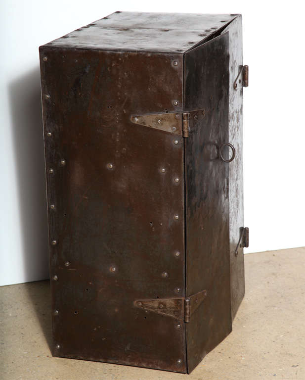 Early 20th Century Hand Constructed Steel Two Door Locking Mechanics Tool Cabinet. Featuring a rectangular form in riveted heavy gauge Steel, with four hinges, three interior shelves and overlapping Hasp locking system. Nice dark patination. Secure