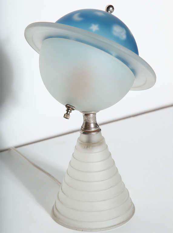 Art Deco, New York World's Fair (1939-1940) beautifully luminescent frosted Glass Saturn Lamp On White frosted skyscraper base, angled, round planetary top.  Half round Blue Saturn top is accented with Stars, Moon, and Saturn with White frosted