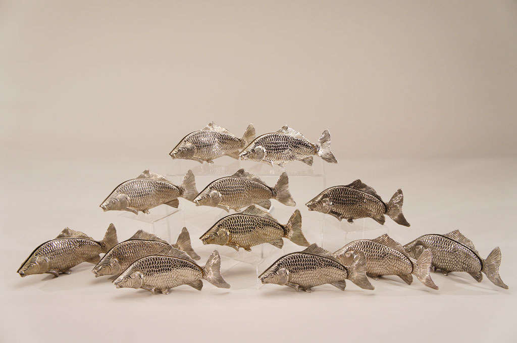  This is now a set of 6 imaginative figural fish sculptures depicting swimming carp. These unusual large swimming fish have an elongated slot in which to place either a menu or perhaps a designation for a table number. These could be used in a