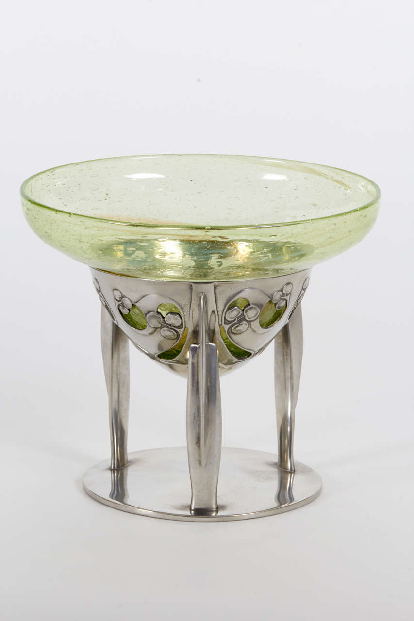 Archibald Knox / Liberty & Co.   Clutha bowl on tri-leg Tudric stand  c. 1902