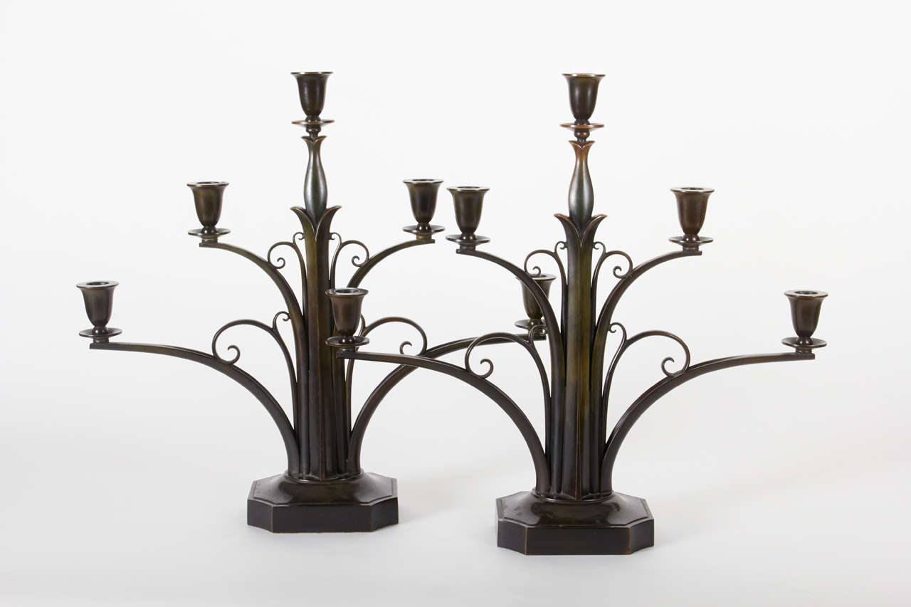 Just Andersen (1884-1943), Denmark.

Pair of five-branch Art Deco candelabra, circa 1925.

Cast and wrought bronze with original rich brown and green patina.

Marks: Denmark just in a triangular cartouche, No. B180.

For more information