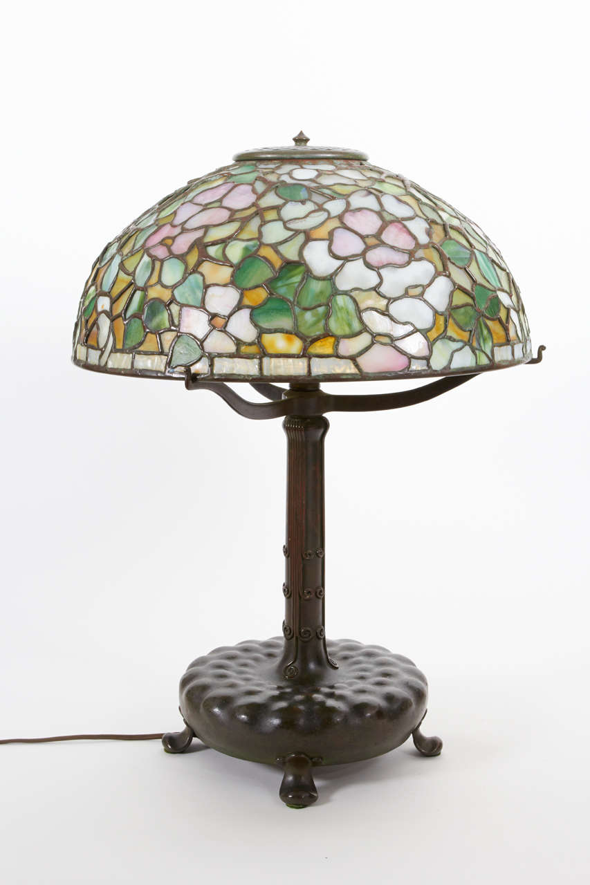 LOUIS C. TIFFANY  (1848-1933)  USA
TIFFANY STUDIOS  New York	

Dogwood Blossom table lamp  c.1906

Stained glass shade in shades of pink, white, gold and green glass with rich brown/green patinated leading and a matching base with a rich