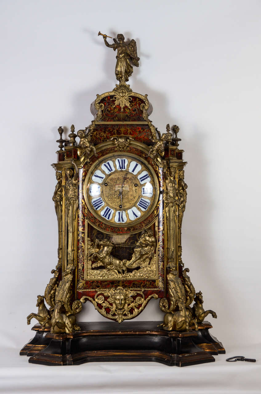 Renommée , Apollon, putti , cariatides ,horses , urns and mascarons .
Marquetry Boulle à la Bérain with birds , dancing boys , monkeys and scrolling leaf.
The clockmaker is  Balthazar Martinot 1660 -1714
