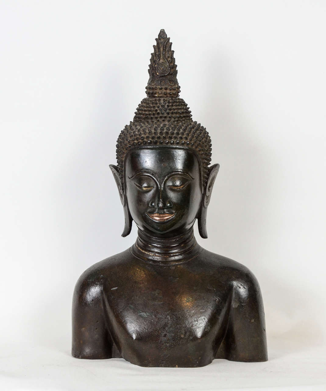 A beautiful head of 17th century bronze Buddha Ayutthaya Siam.
the lips are golden.