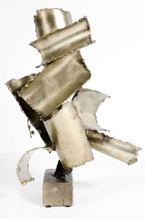 A Brutalist abstract sculpture comprising torch cut and welded steel pieces balanced on a steel channel base. Stamped [Fantoni]. Italy, circa 1960.