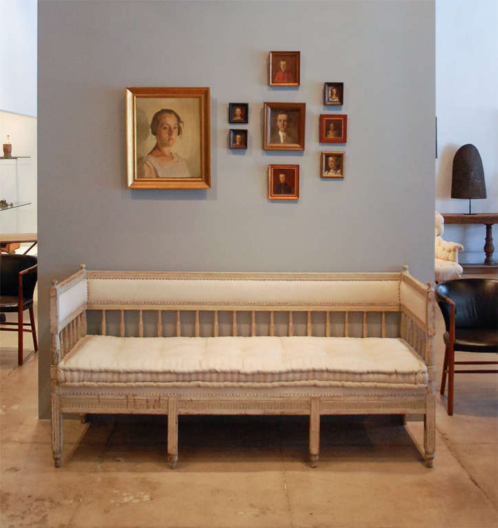 a beautiful gustavian daybed with a newly upholstered seat cushion.
