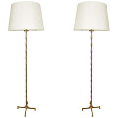 Pair of faux bamboo floor lamps by Adnet