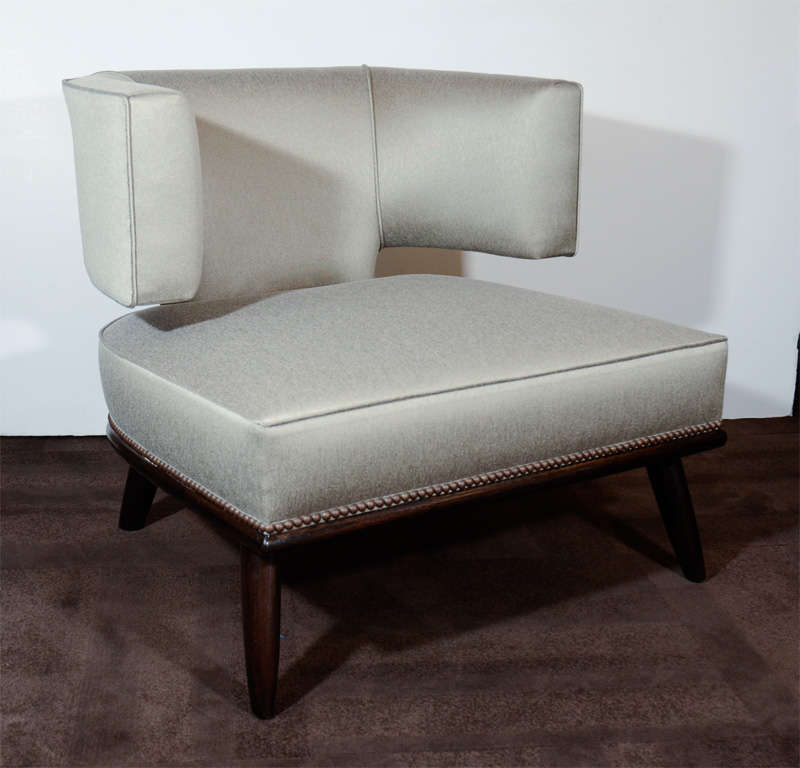 These ultra chic chairs feature great stylized Klismos backs with ebonized walnut legs and antique brass stud detailing. Newly upholstered in a metallic sharkskin fabric.