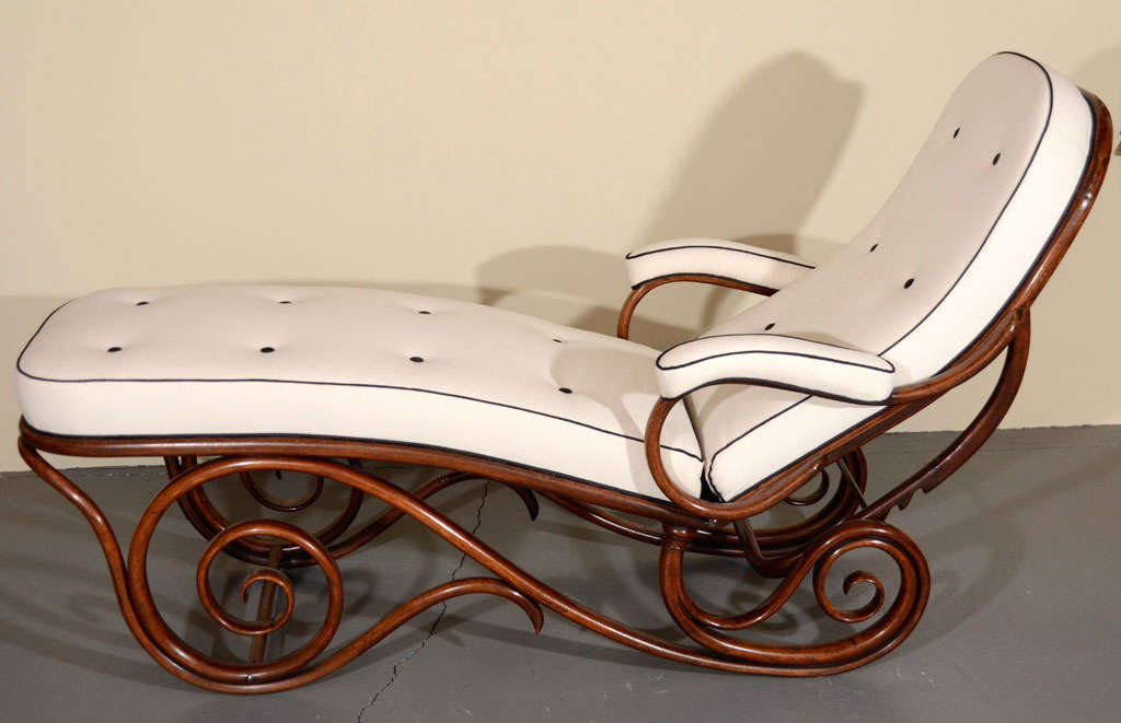 A Viennese bentwood and upholstered chaise longue, late 19th century, by Thonet and bearing paper label.

Model 9702. Original surface.