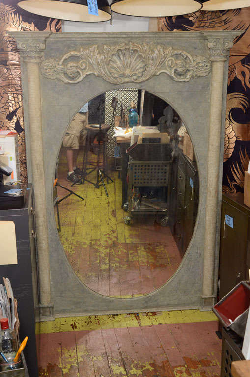 Oval blackened Antique Mirror, with Corinthian columns and shell cartouche' details.