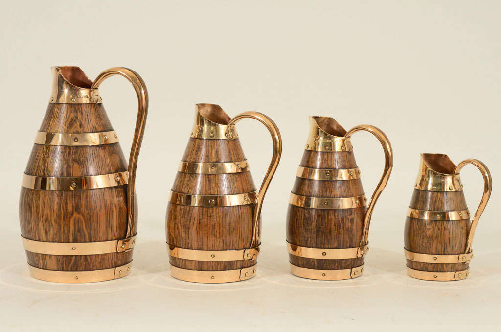 Set of 4 Graduated Oak & Brass Wine Jugs, Late 19th C.