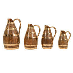 Antique Set of 4 Graduated Oak 
Brass Wine Jugs, Late 19th C.