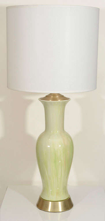 Pair of mint condition celery green striated Murano glass lamps on satin brass bases.