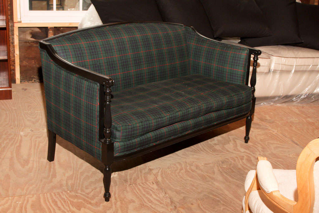 Newly black lacquered wood settee with reeded, ring turned arms and legs. Upholstered in a Classic Ralph Lauren wool tartan fabric.