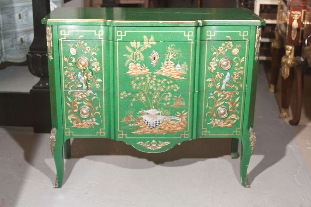 A green painted Chinoiserie style French commode with beautiful painted scene on cabriole legs, made by John Widdicomb.