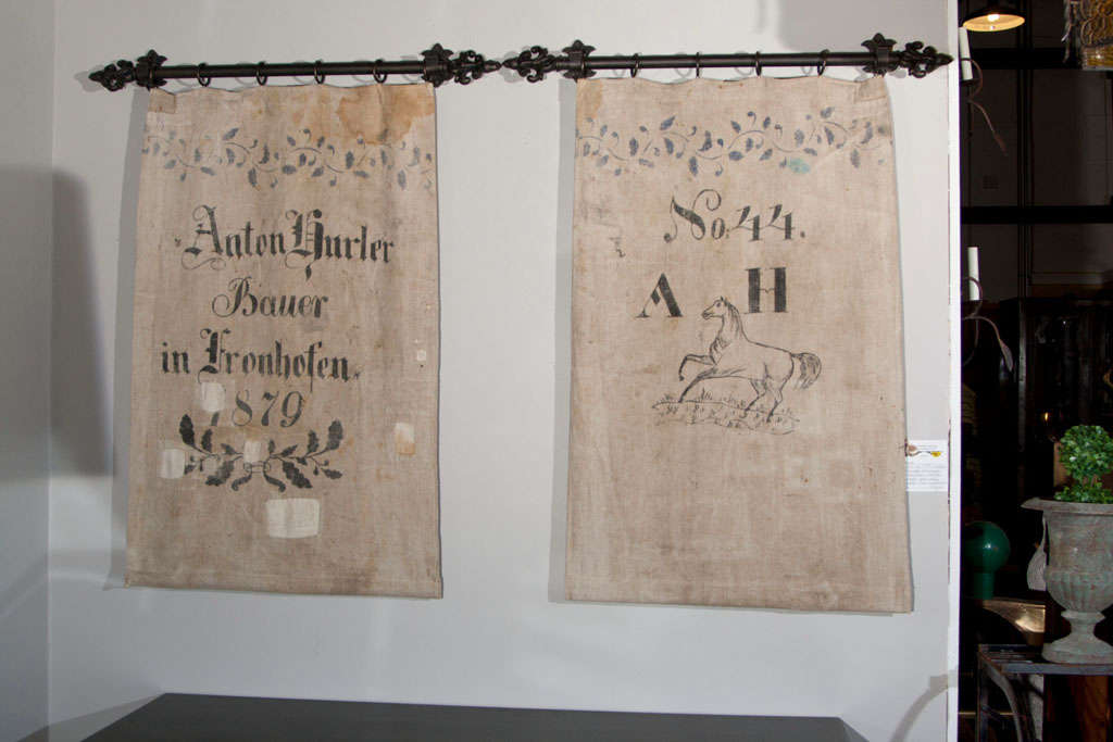Pair of fabulous German grain sack tapestries, late 19th century, each with hand-painted letter and pattern, one with a very rare horse pattern, custom-made to hang on metal rods.