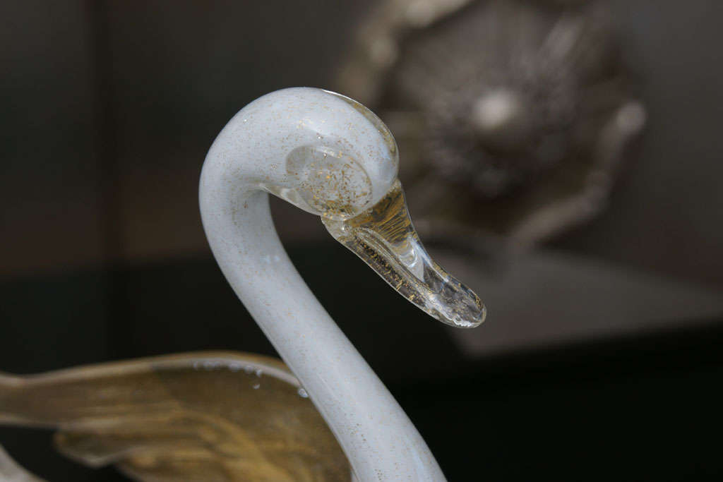 Wonderful pair of white, opaque and gold hand blown murano glass swans by Barbini.<br />
The swans have beautiful detailing to their wings which have gold dust in them.