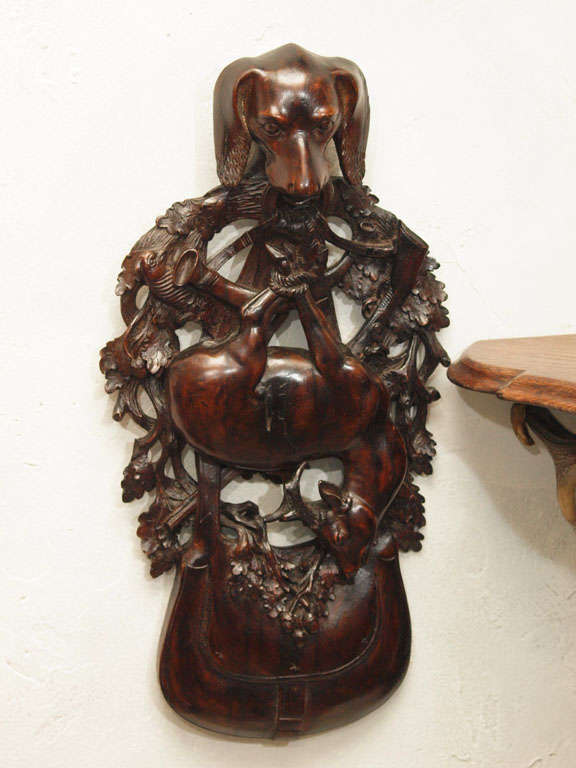 Black Forest wall carving with objects of the hunt. Circa 1920