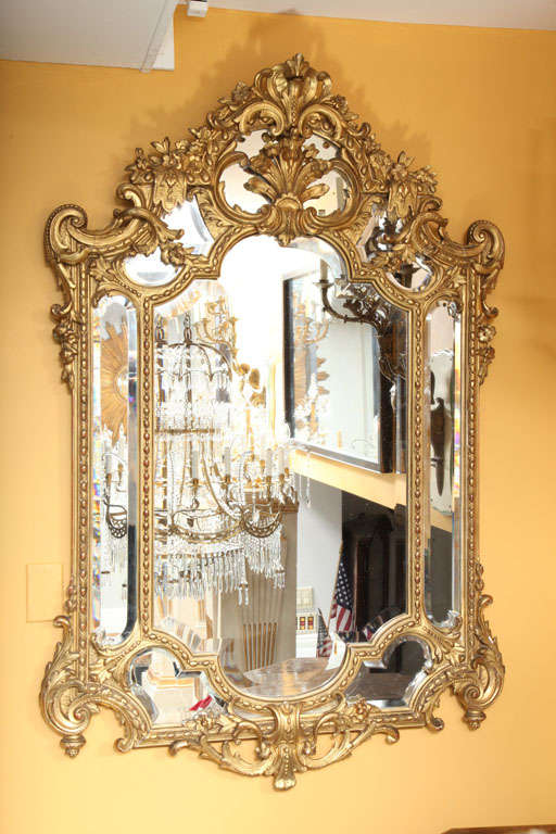 A French Louis XVI Style Carved Wood and Gesso Mirror.