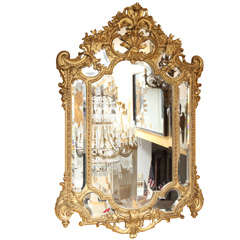 A French Louis XVI Style Carved Wood and Gesso Mirror.