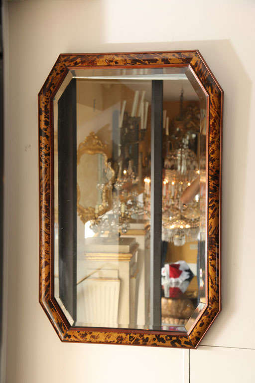 An Octagonal Tortoise Shell Veneered Mirror with Beveled Glass.