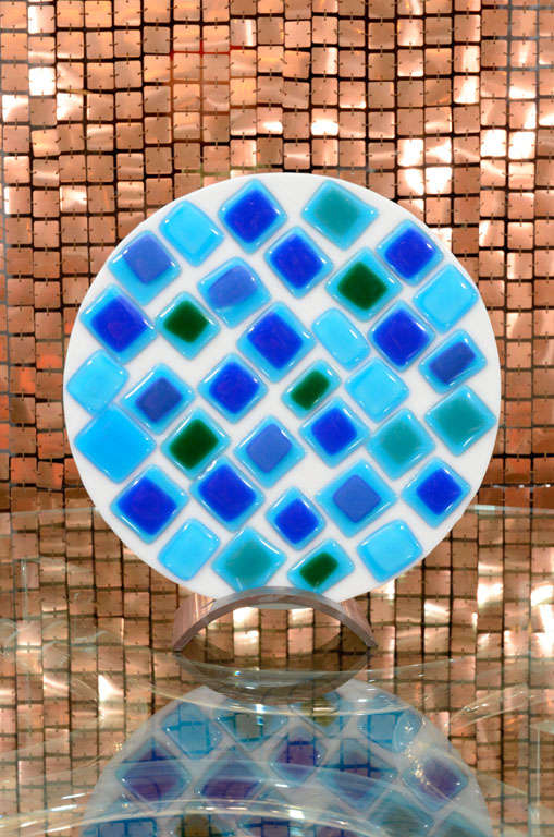 Beautiful and colorful art glass plate decorated with fused glass tiles. It is supported in a nicely weighted bronze base. Offered by Las Venus by Kenneth Clark, New York City.