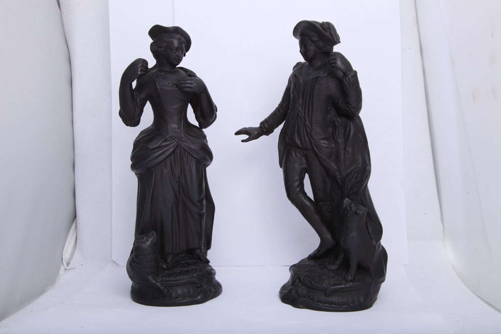A rare pair of unmarked Enoch Wood basalt figures of a shepherd and shepherdess