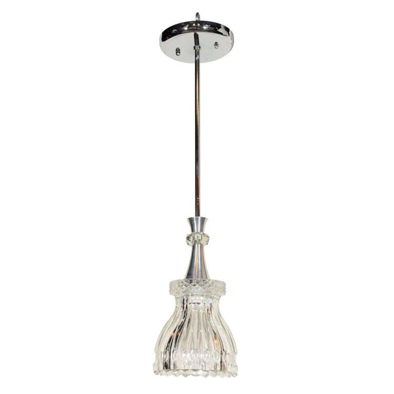 Elegant mid century modern cut crystal pendant light.  Molded glass shade features beautiful cross hatch designs and fluted details. Fitted with brushed aluminum fitting and a cut crystal ring, and has polished nickel stem. Stem can be cut down to