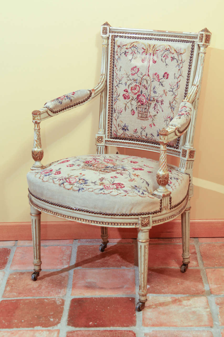 French Louis XVI Painted Arm Chair

This is a wonderful period Louis XVI fauteuil.  It is painted grey (darker than the images shown here) with gilt accents.

This chair is beautifully carved with the traditional Louis XVI form. All four feet