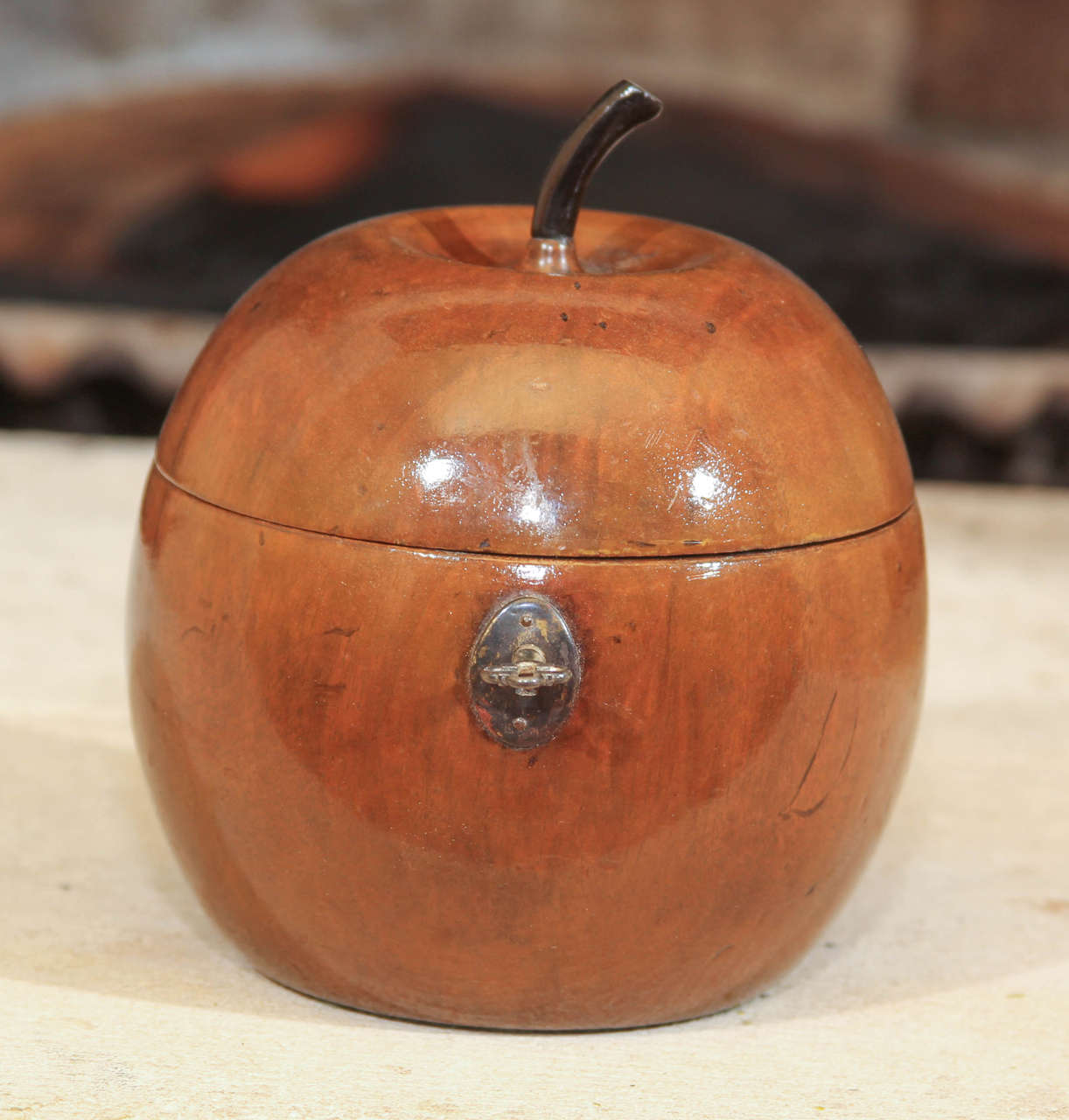 English Victorian Apple Tea Caddy

This is a wonderful English apple wood tea caddy in the shape of an apple.  

It features the original lock, key and hinge. The top has an ebonized stem.

The entire piece was made from one piece of apple